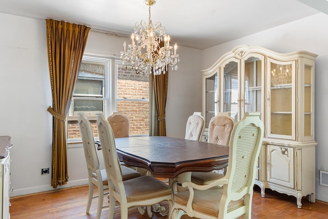 8952 S E End Ave, Chicago, IL 60617 - dining room with a chandelier, light wood-type flooring, and baseboards
