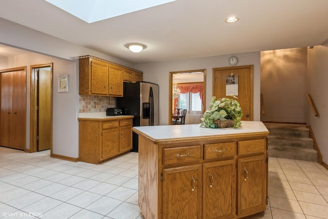 19510 Blyth Way, Mokena, IL 60448 - kitchen with light countertops, light tile patterned floors, tasteful backsplash, brown cabinetry, and recessed lighting