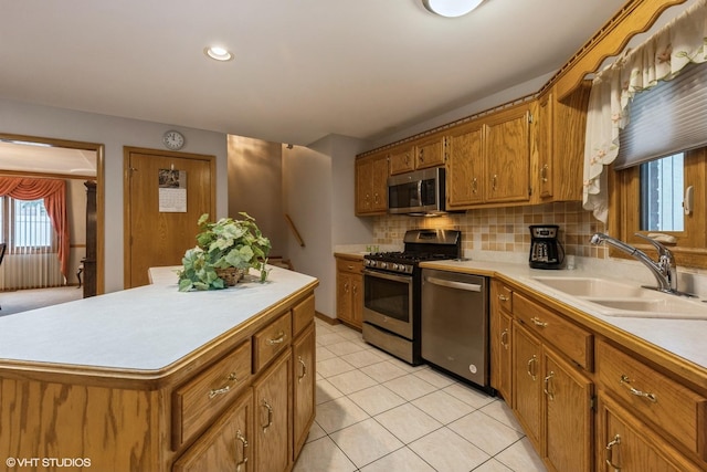 19510 Blyth Way, Mokena, IL 60448 - kitchen with appliances with stainless steel finishes, a sink, light countertops, brown cabinets, and recessed lighting