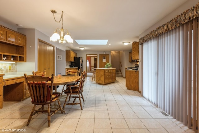 19510 Blyth Way, Mokena, IL 60448 - dining room with a skylight, light tile patterned flooring, and a chandelier