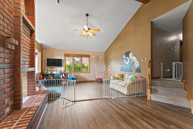 8542 Monaghan Dr, Tinley Park, IL 60487 - living area featuring wood finished floors, ceiling fan, baseboards, high vaulted ceiling, and stairs