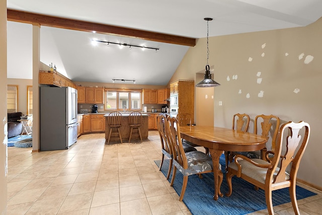 8542 Monaghan Dr, Tinley Park, IL 60487 - dining room featuring rail lighting, beam ceiling, light tile patterned floors, and high vaulted ceiling