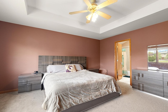 8542 Monaghan Dr, Tinley Park, IL 60487 - bedroom featuring light colored carpet, a raised ceiling, a ceiling fan, ensuite bath, and baseboards