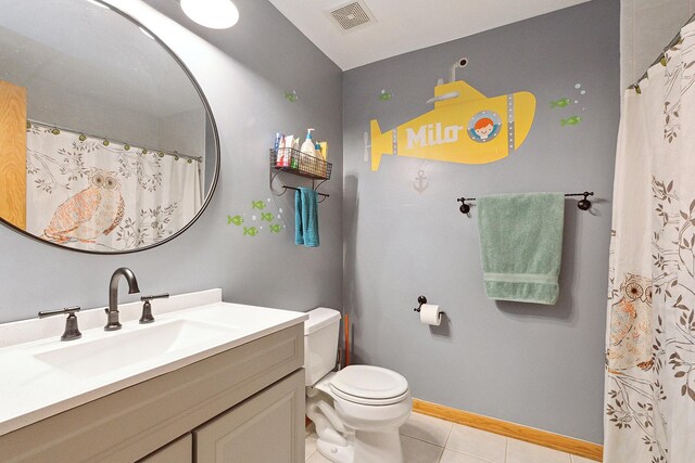 8542 Monaghan Dr, Tinley Park, IL 60487 - full bath with vanity, toilet, tile patterned flooring, baseboards, and a shower with curtain