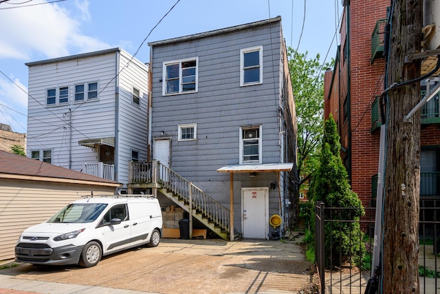 2002 W Huron St, Chicago, IL 60612 - rear view of property featuring stairway