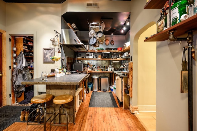 2002 W Huron St, Chicago, IL 60612 - bar area with light wood-style floors and arched walkways