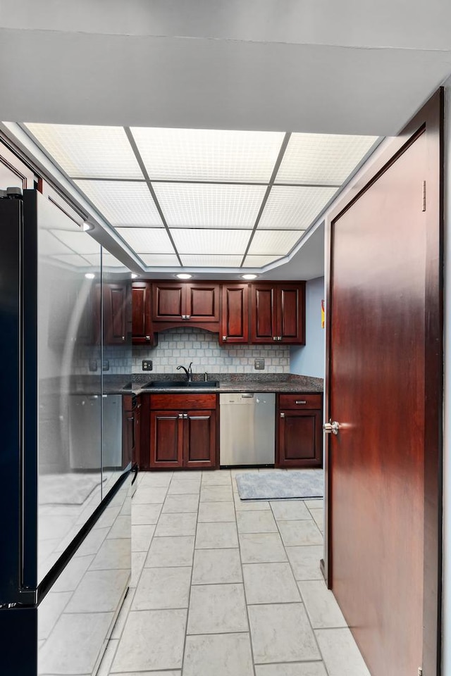825 Center St Unit 302, Des Plaines, IL 60016 - kitchen featuring stainless steel dishwasher, reddish brown cabinets, high end fridge, dark countertops, and tasteful backsplash