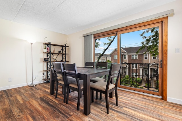825 Center St Unit 302, Des Plaines, IL 60016 - dining space with wood finished floors, baseboards, and a textured ceiling