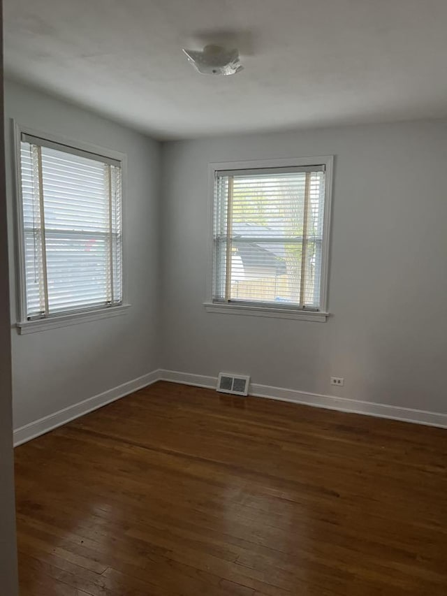 2517 S 4th Ave, North Riverside, IL 60546 - empty room featuring dark wood-style flooring and baseboards