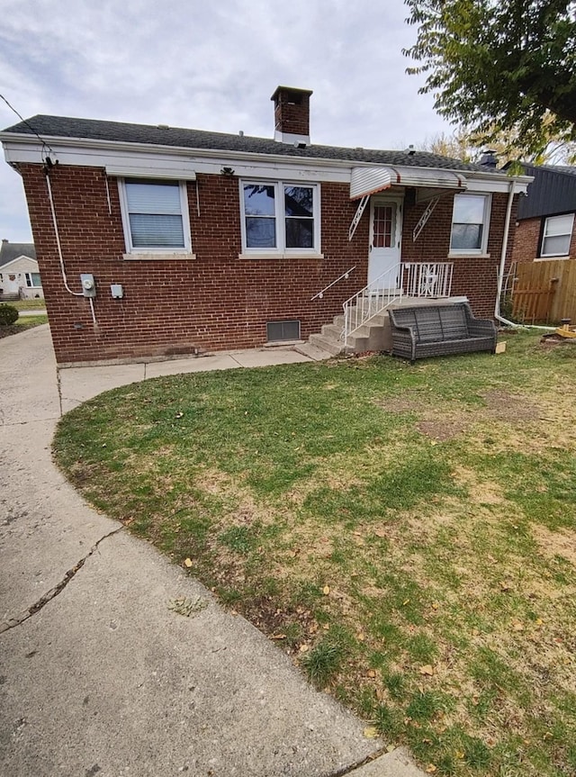 2517 S 4th Ave, North Riverside, IL 60546 - view of front of house with brick siding, a front lawn, and a chimney