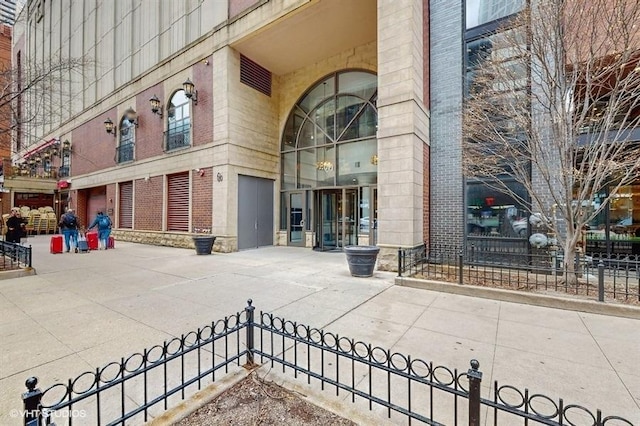 630 N State St Unit 2403, Chicago, IL 60654 - view of exterior entry featuring brick siding and stone siding