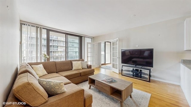 630 N State St Unit 2403, Chicago, IL 60654 - living room featuring light wood-style flooring and baseboards