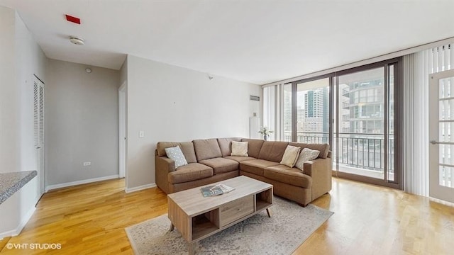 630 N State St Unit 2403, Chicago, IL 60654 - living room with light wood-style flooring, healthy amount of natural light, and baseboards