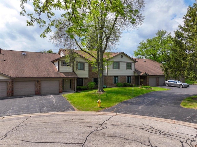 1611 W Partridge Ct Unit 8, Arlington Heights, IL 60004 - multi unit property featuring brick siding, asphalt driveway, a garage, and a front yard