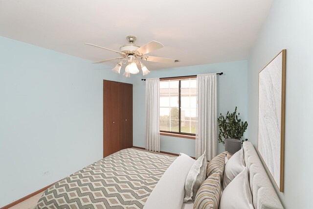 1611 W Partridge Ct Unit 8, Arlington Heights, IL 60004 - bedroom featuring baseboards, ceiling fan, a closet, and carpet