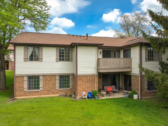 1611 W Partridge Ct Unit 8, Arlington Heights, IL 60004 - rear view of property featuring a balcony, a patio, brick siding, and a lawn