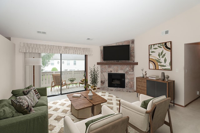 1611 W Partridge Ct Unit 8, Arlington Heights, IL 60004 - living area with light colored carpet, lofted ceiling, a stone fireplace, and baseboards