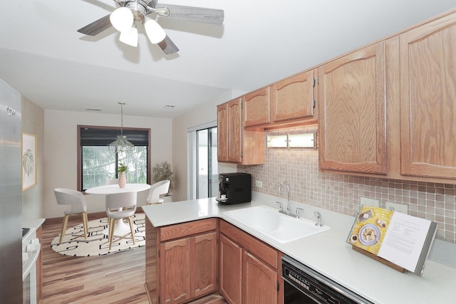 1611 W Partridge Ct Unit 8, Arlington Heights, IL 60004 - kitchen with a sink, light wood-style flooring, light countertops, tasteful backsplash, and a peninsula