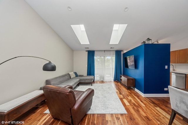 1411 W Partridge Ln Unit 4, Arlington Heights, IL 60004 - living room with a skylight and light wood-style flooring