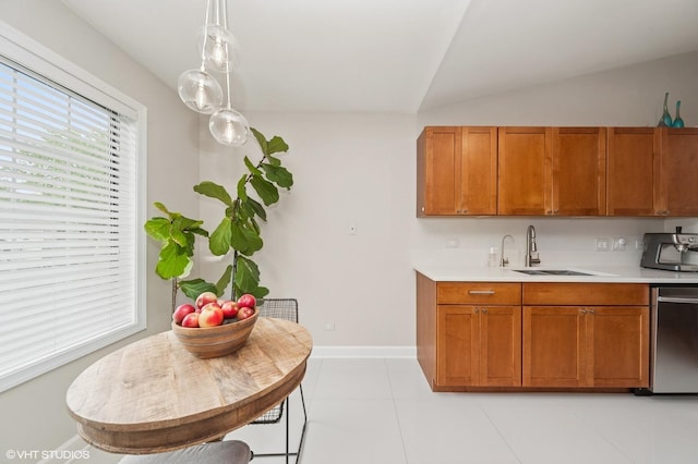 1411 W Partridge Ln Unit 4, Arlington Heights, IL 60004 - kitchen featuring light countertops, stainless steel dishwasher, a sink, brown cabinets, and lofted ceiling
