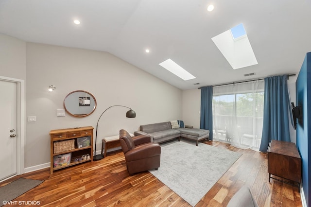 1411 W Partridge Ln Unit 4, Arlington Heights, IL 60004 - living room featuring a skylight, vaulted ceiling, light wood-style floors, recessed lighting, and baseboards