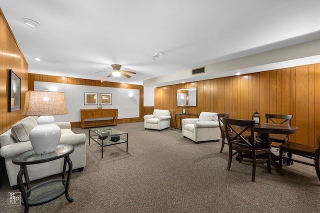 7525 Nantucket Dr Unit 109, Darien, IL 60561 - living area with wood walls, ceiling fan, and carpet
