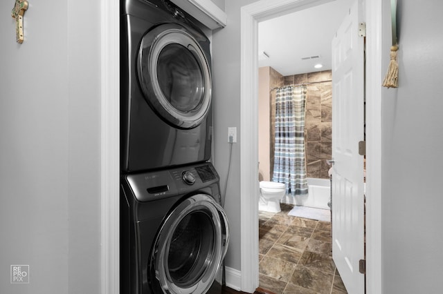7525 Nantucket Dr Unit 109, Darien, IL 60561 - washroom with stacked washing machine and dryer, stone finish flooring, and recessed lighting