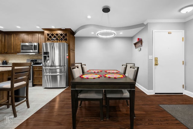 7525 Nantucket Dr Unit 109, Darien, IL 60561 - dining room featuring ornamental molding, baseboards, wood finished floors, recessed lighting, and a chandelier