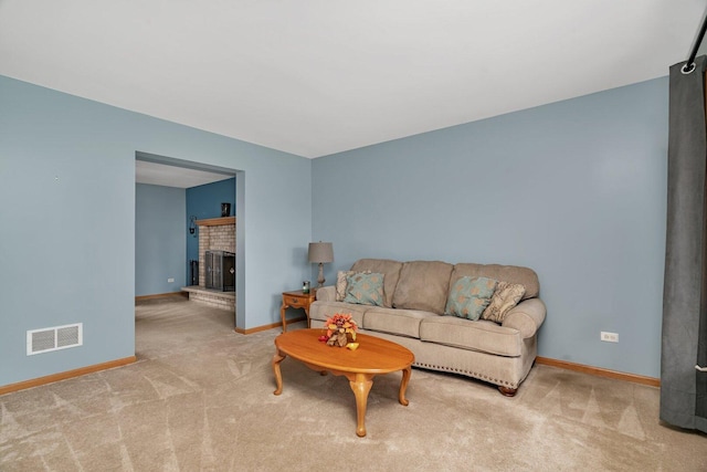601 High Grove Dr, Minooka, IL 60447 - living room featuring carpet, baseboards, and a brick fireplace