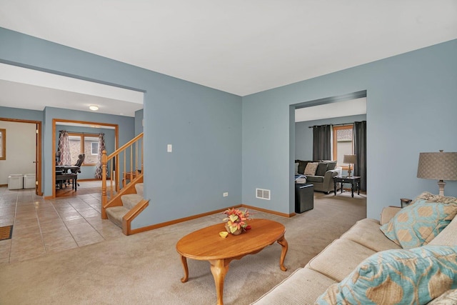 601 High Grove Dr, Minooka, IL 60447 - living room featuring carpet floors, baseboards, and stairs