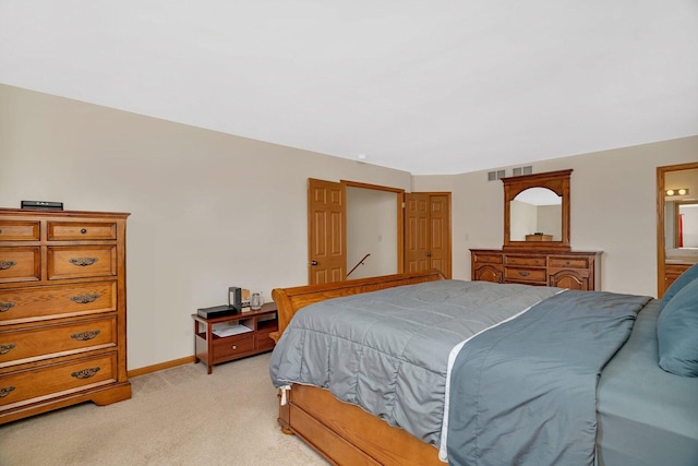 601 High Grove Dr, Minooka, IL 60447 - bedroom featuring light colored carpet, baseboards, and connected bathroom