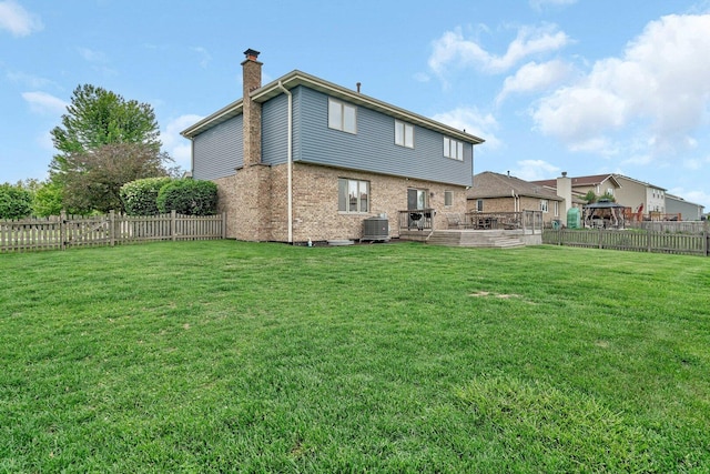601 High Grove Dr, Minooka, IL 60447 - rear view of property featuring a chimney, brick siding, and cooling unit