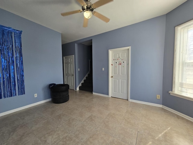 5747 S Laflin St, Chicago, IL 60636 - tiled empty room with a ceiling fan, plenty of natural light, and baseboards
