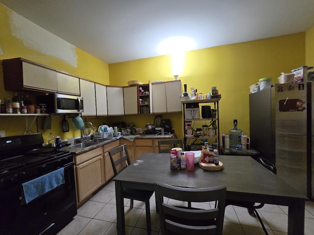5747 S Laflin St, Chicago, IL 60636 - kitchen with stainless steel appliances, open shelves, light tile patterned flooring, and a sink