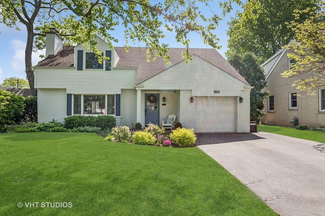 1161 Vernon Dr, Glenview, IL 60025 - view of front facade with a chimney, concrete driveway, an attached garage, and a front yard