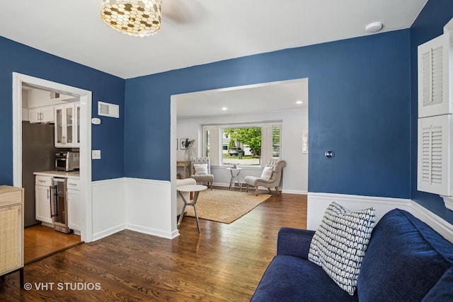 1161 Vernon Dr, Glenview, IL 60025 - living area with dark wood-style floors, wine cooler, and baseboards
