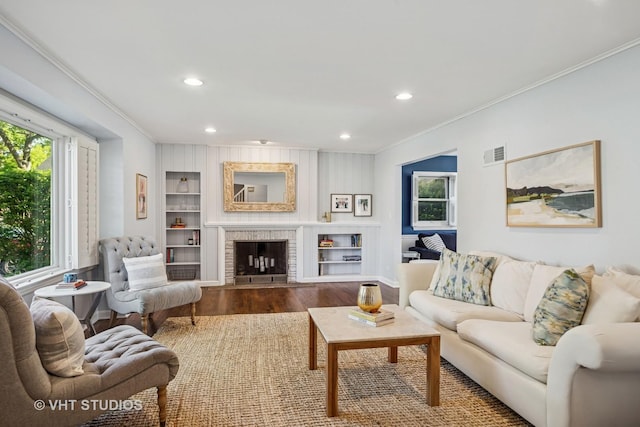 1161 Vernon Dr, Glenview, IL 60025 - living area featuring ornamental molding, wood finished floors, recessed lighting, built in features, and a fireplace