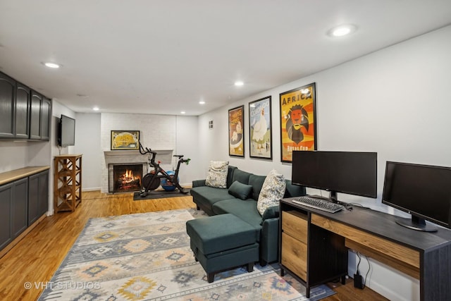 1161 Vernon Dr, Glenview, IL 60025 - office with light wood-style flooring, a brick fireplace, recessed lighting, and baseboards