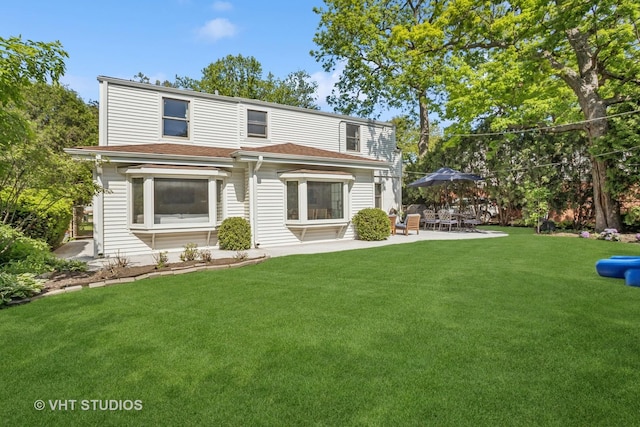 1161 Vernon Dr, Glenview, IL 60025 - back of house with a patio area and a lawn