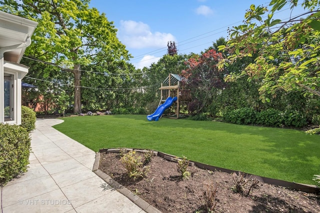 1161 Vernon Dr, Glenview, IL 60025 - view of green lawn featuring a playground