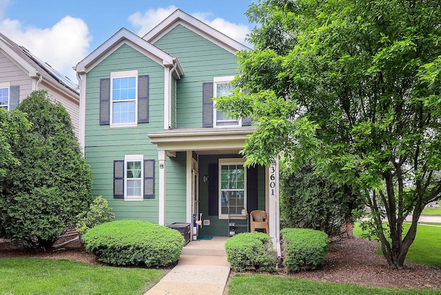 3601 Daisy Ln, Elgin, IL 60124 - view of front of house with a porch and a front lawn