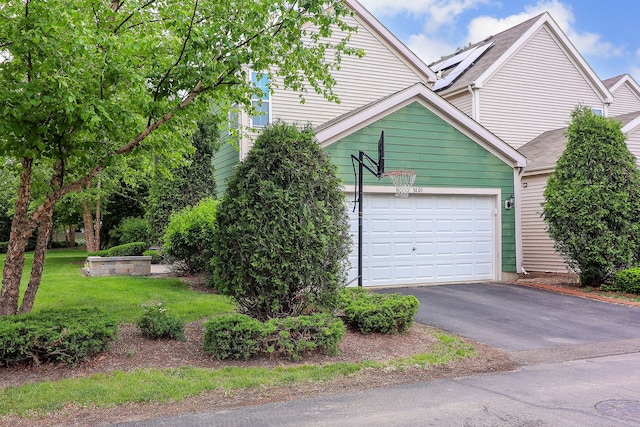 3601 Daisy Ln, Elgin, IL 60124 - view of front of house with driveway, a front lawn, and an attached garage