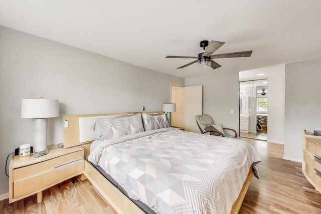 2700 E Bel Aire Dr Unit 202, Arlington Heights, IL 60004 - bedroom featuring light wood-style floors, baseboards, and a ceiling fan