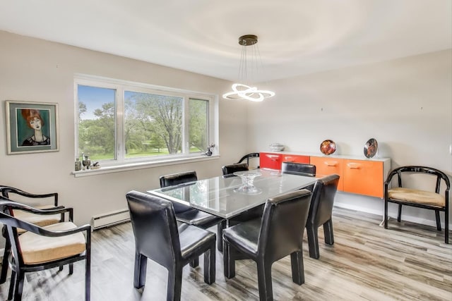 2700 E Bel Aire Dr Unit 202, Arlington Heights, IL 60004 - dining room featuring baseboard heating, a chandelier, and light wood-style flooring