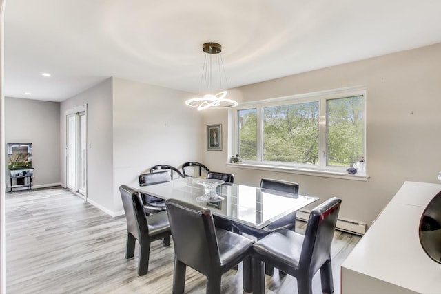 2700 E Bel Aire Dr Unit 202, Arlington Heights, IL 60004 - dining area featuring a baseboard heating unit, a chandelier, light wood finished floors, recessed lighting, and baseboards