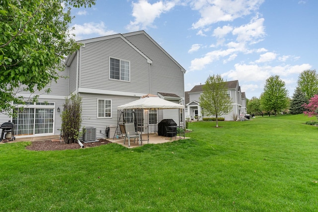 310 Cascade Ln Unit 310, Oswego, IL 60543 - rear view of house with a gazebo, a patio area, a lawn, and central AC