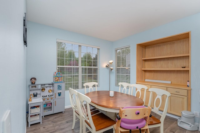 310 Cascade Ln Unit 310, Oswego, IL 60543 - dining room with light wood finished floors