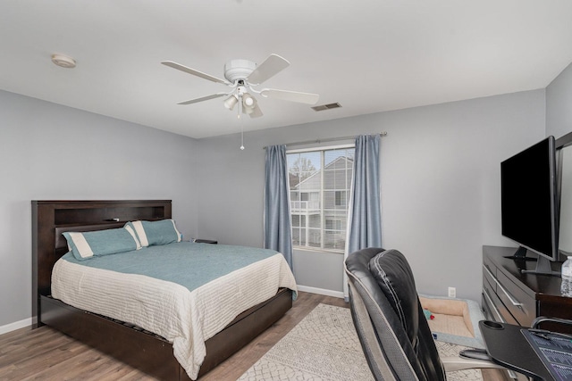 310 Cascade Ln Unit 310, Oswego, IL 60543 - bedroom featuring wood finished floors, baseboards, and ceiling fan