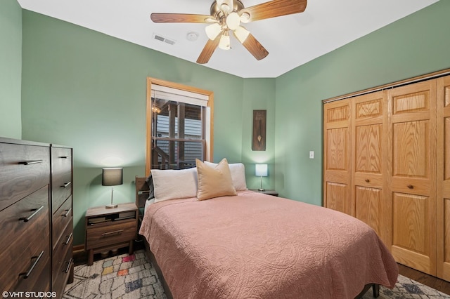 2235 N Saint Louis Ave Unit 1, Chicago, IL 60647 - bedroom with a closet, a ceiling fan, and light wood-type flooring