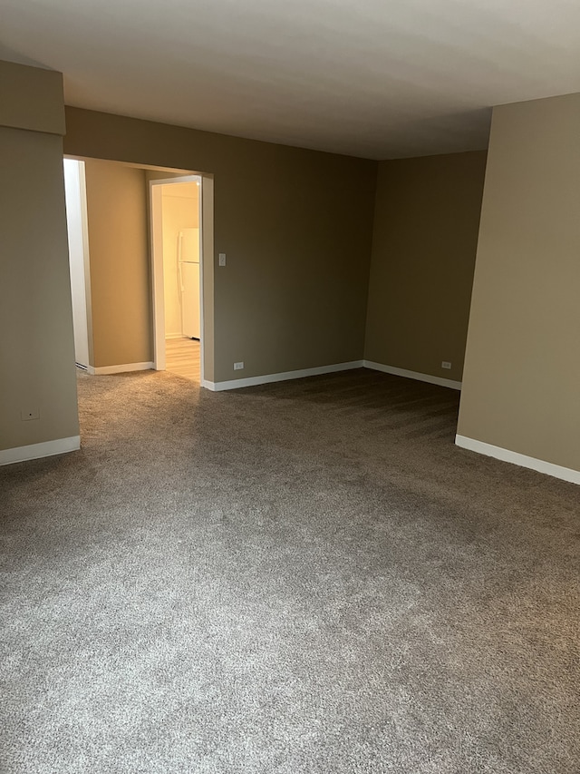 7337 S S Shore Dr Unit 216, Chicago, IL 60649 - carpeted spare room featuring baseboards